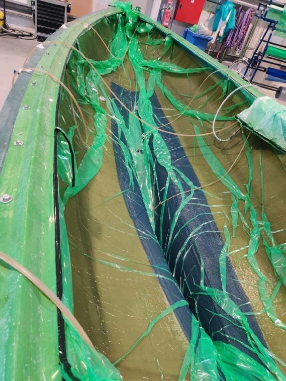 Infusion mesh and resin lines laid over the laminate