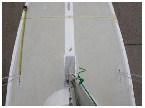 Measuring from the taped station 4 line to the front face of the upper shroud (step 5).