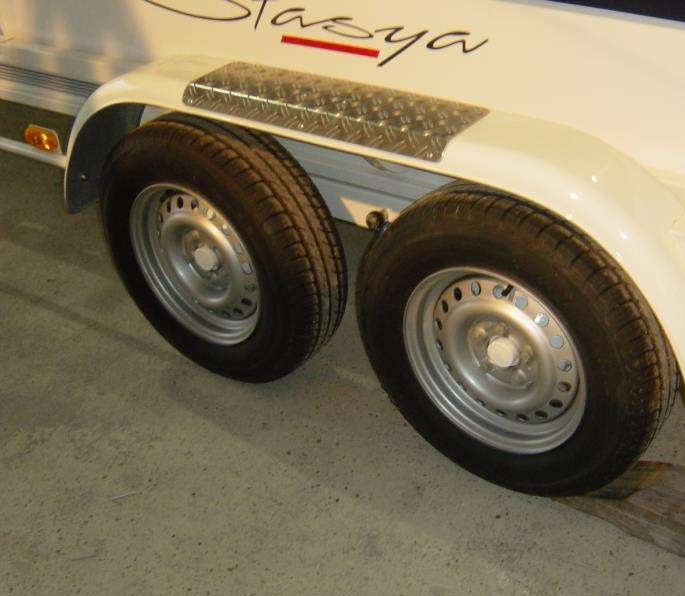 Trailer wheel driven onto a wooden wedge